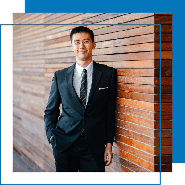 businessperson by wall